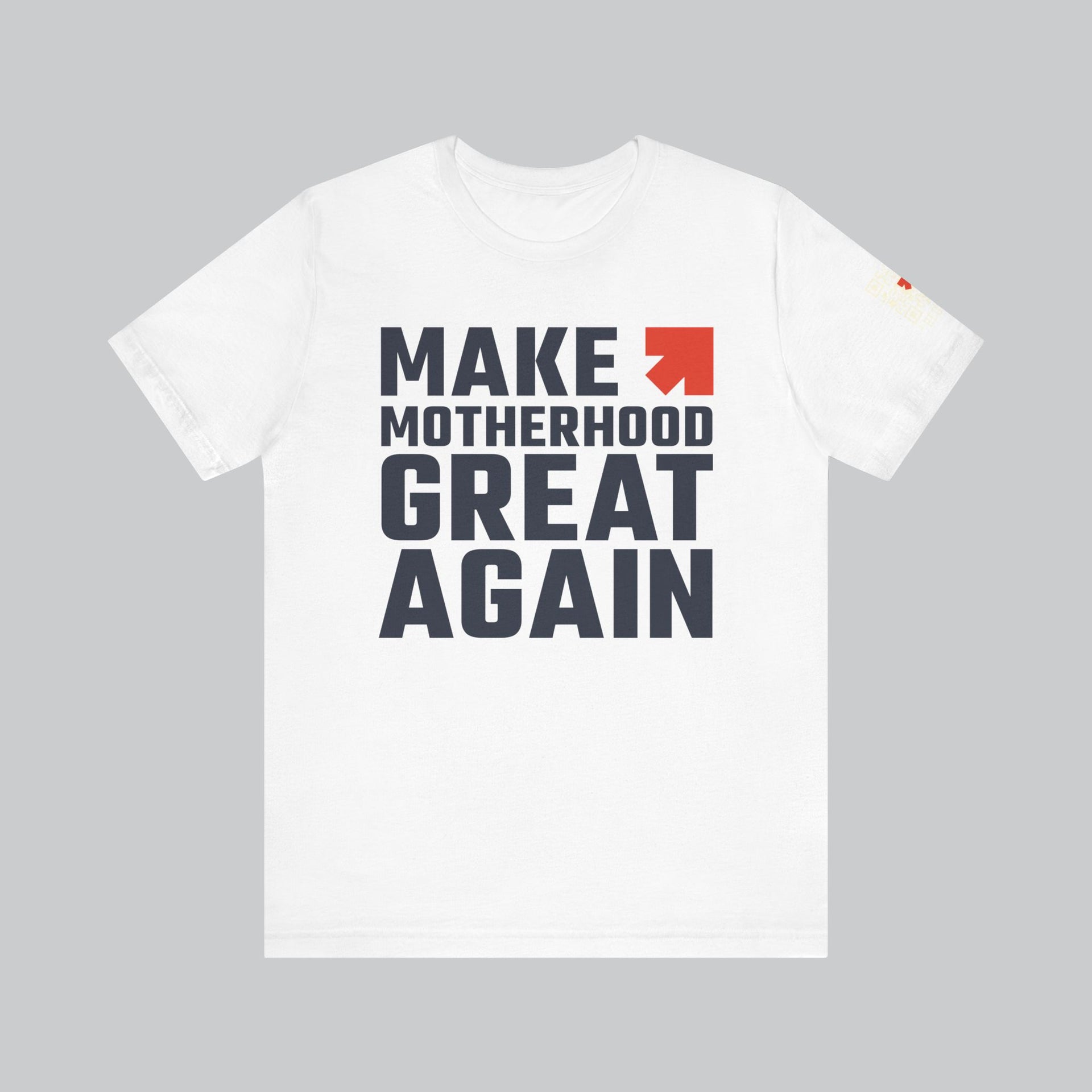 Image of white t shirt with saying "make motherhood great again" in blue text with REDGlare arrow logo celebrating motherhood and not wokeness