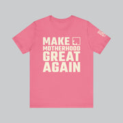 Image of pink t shirt with saying "make motherhood great again" in white text with REDGlare arrow logo celebrating motherhood and not wokeness